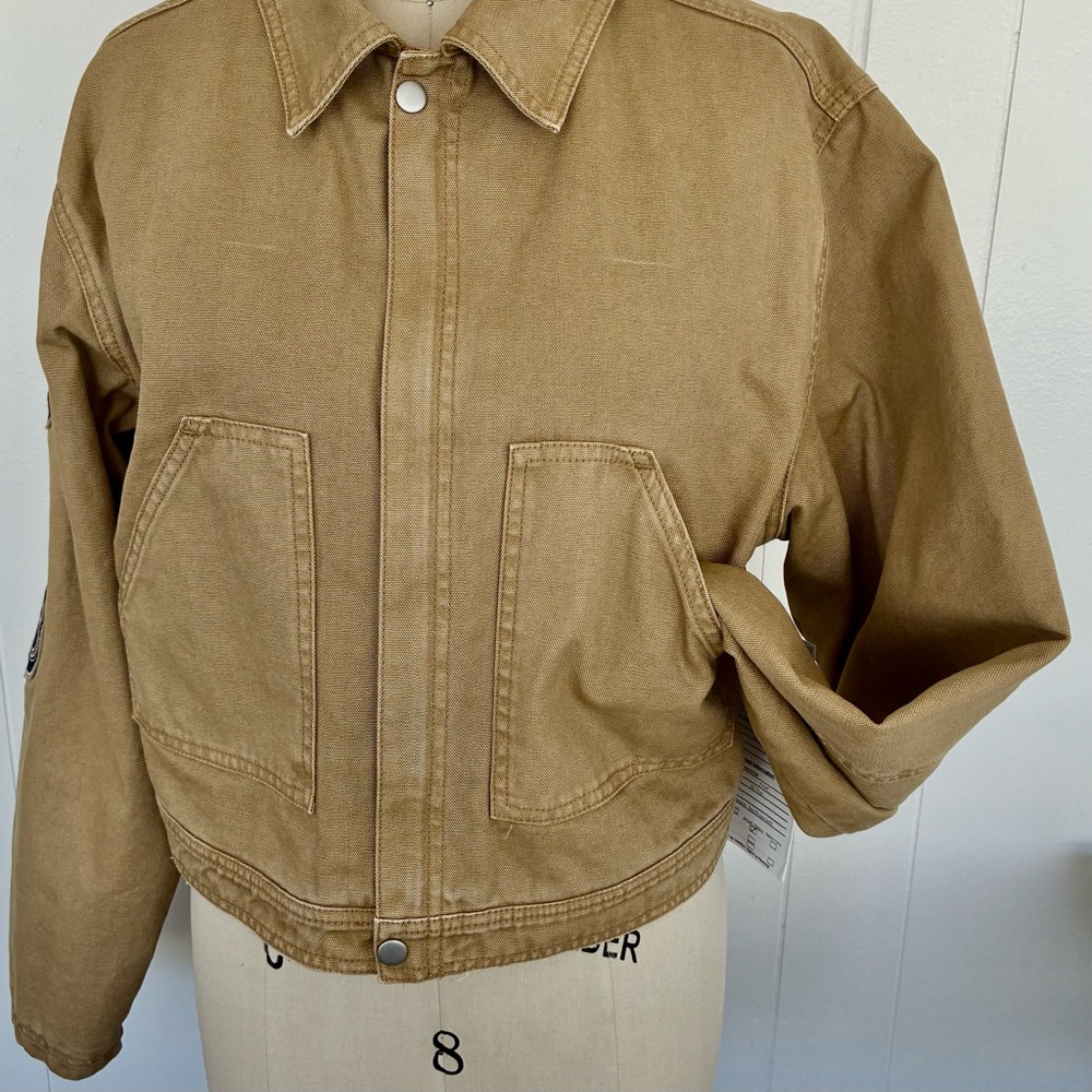 Price dropped take advantage Tan Jacket w pkts lined quilted satin back graphics